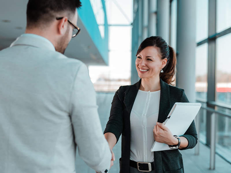 businessman and businesswoman shaking hands