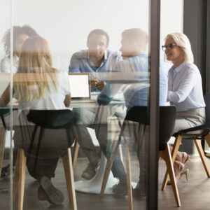 diverse employees discuss ideas together in a conference room